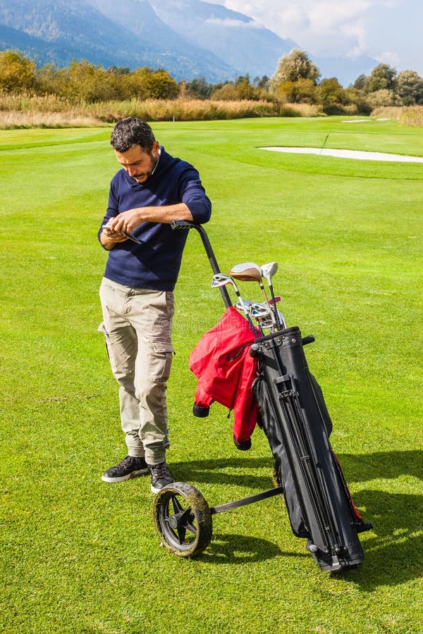Classy Golfer Picking a Club Stock Photo Image of player, green 54279108