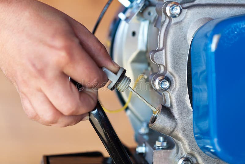 Checking the Oil Level on a Small Combustion Engine Stock Image Image