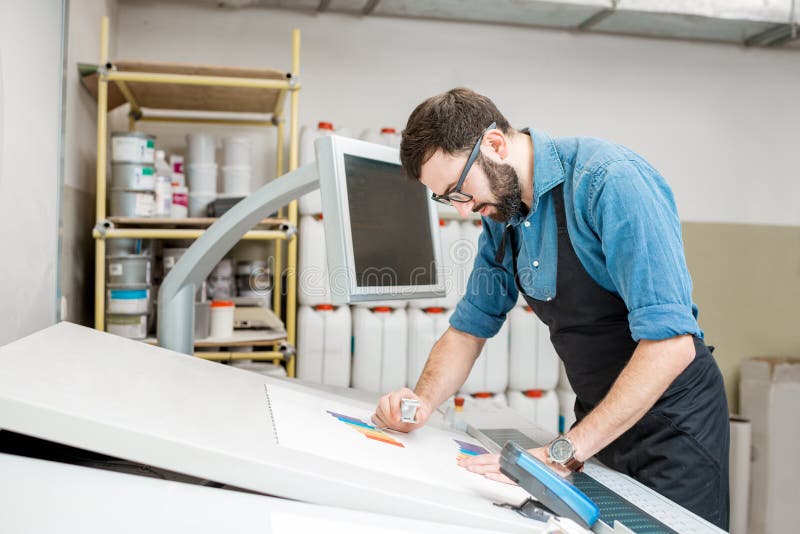 Checking the Quality of the Printing with Magnifying Glass Stock Image