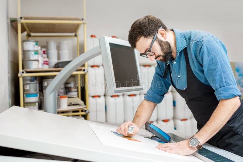 Checking the quality of the printing with magnifying glass stock image Checking the quality of the printing with magnifying glass stock image