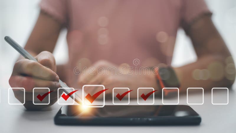 Checklist concept. Businesswoman using a laptop. Checking marks on checkboxes on the futuristic virtual interface screen stock image