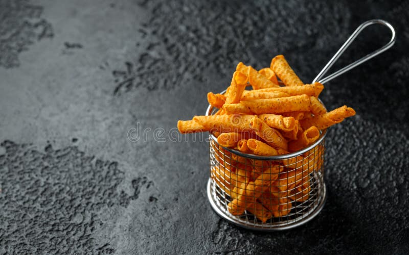 Cheddar Cheese Tortilla Rolls, Chips in Serving Basket Stock Photo