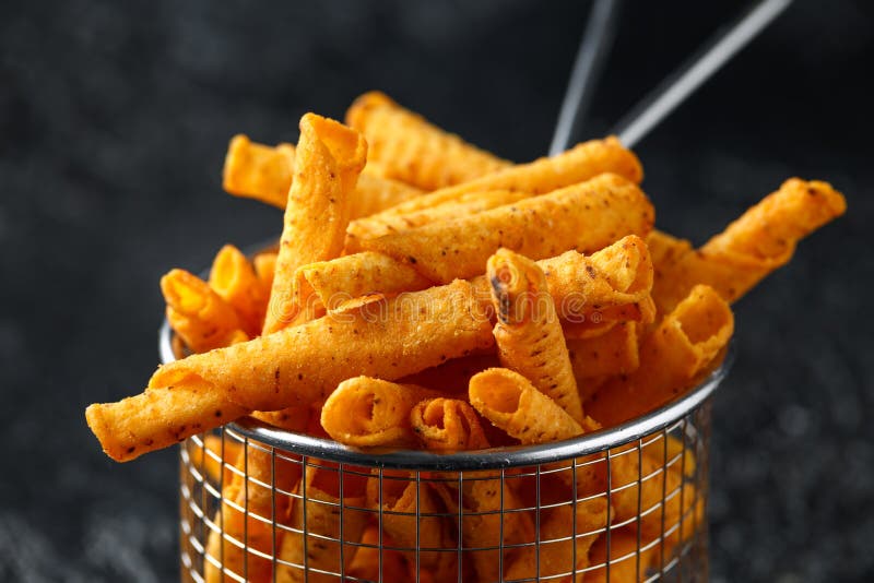 Cheddar Cheese Tortilla Rolls, Chips in Serving Basket Stock Photo