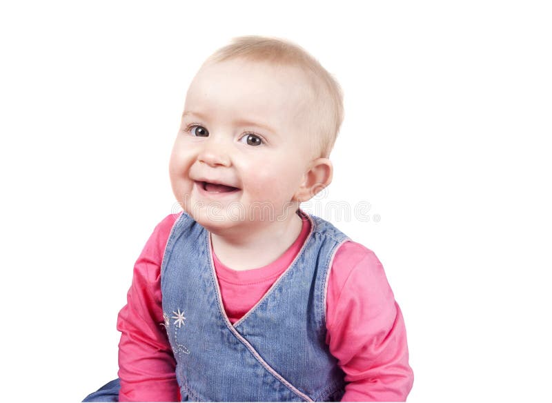 Cheeky baby girl looking at camera smiling