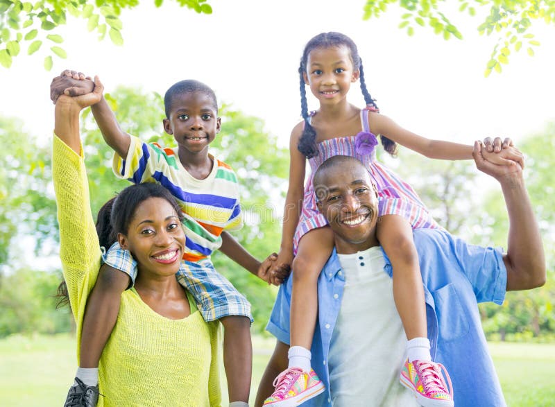 Cheerful African Family Bonding Outdoors