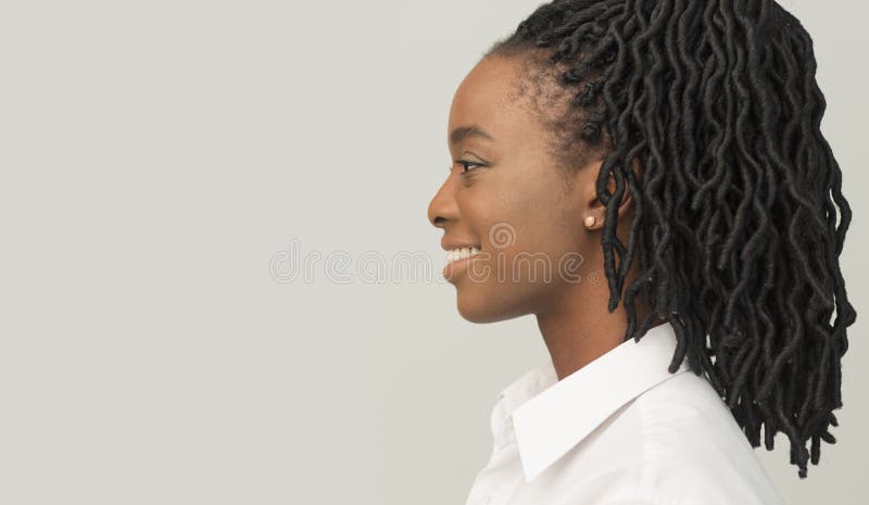 Afro Business Girl Standing On Gray Background, Profile Portrait, Studio