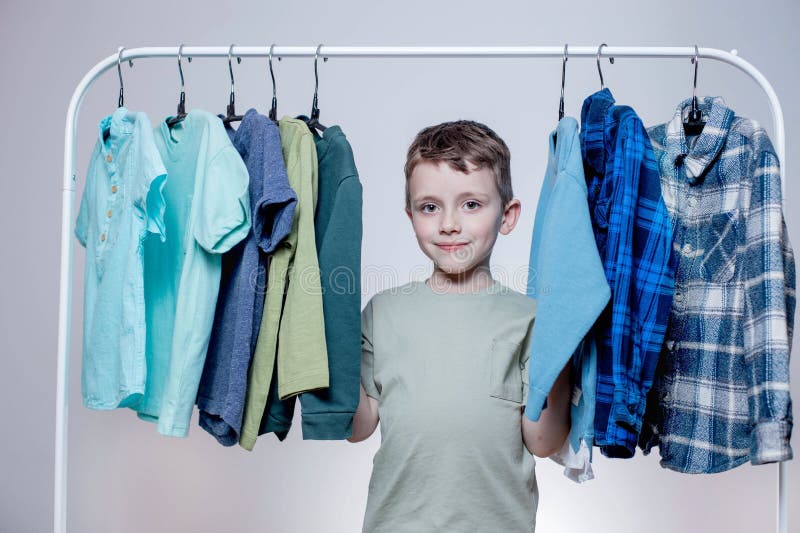 Premium Photo  Little asian boy using hanger hang up a clothes on