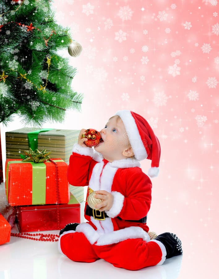 Cheerful boy in Santa Claus hat stock photos