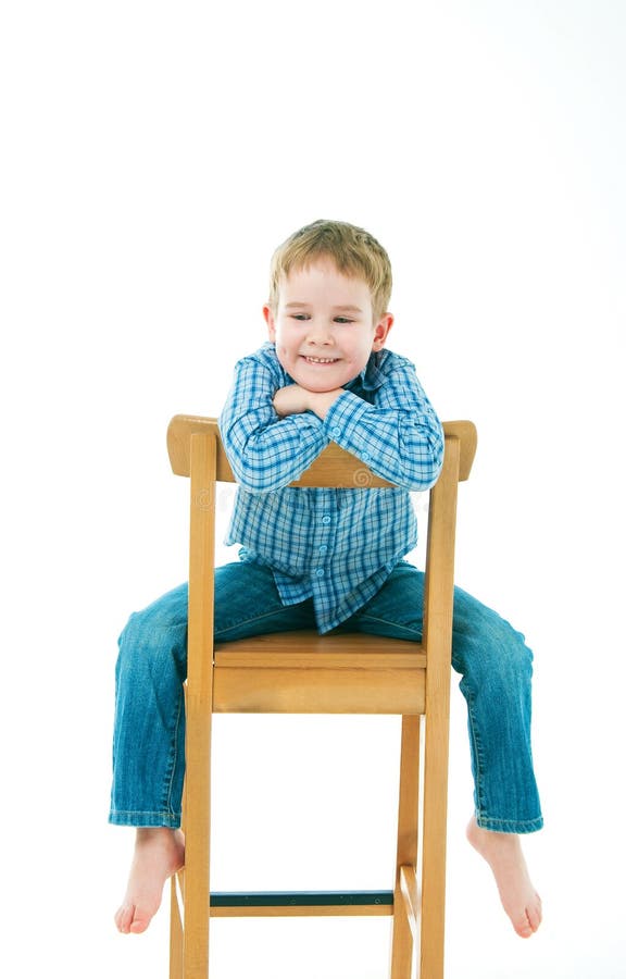 Portrait of a Happy Pre-teen Boy Sitting on Director S Chair Over White ...