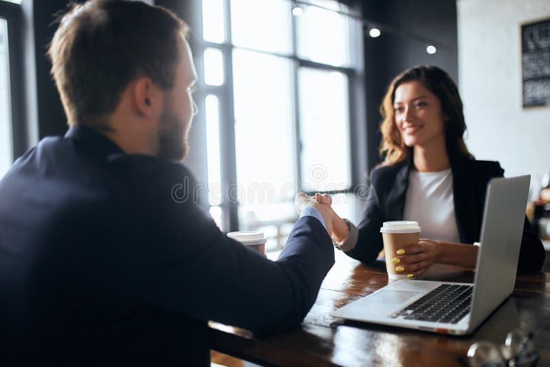 Cheerful Brunette Woman And Brow Haired Bearded Man Shaking Hands Stock Image Image Of