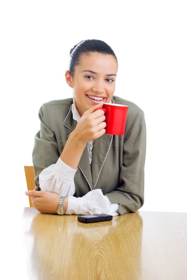 Cheerful businesswoman drinking coffee