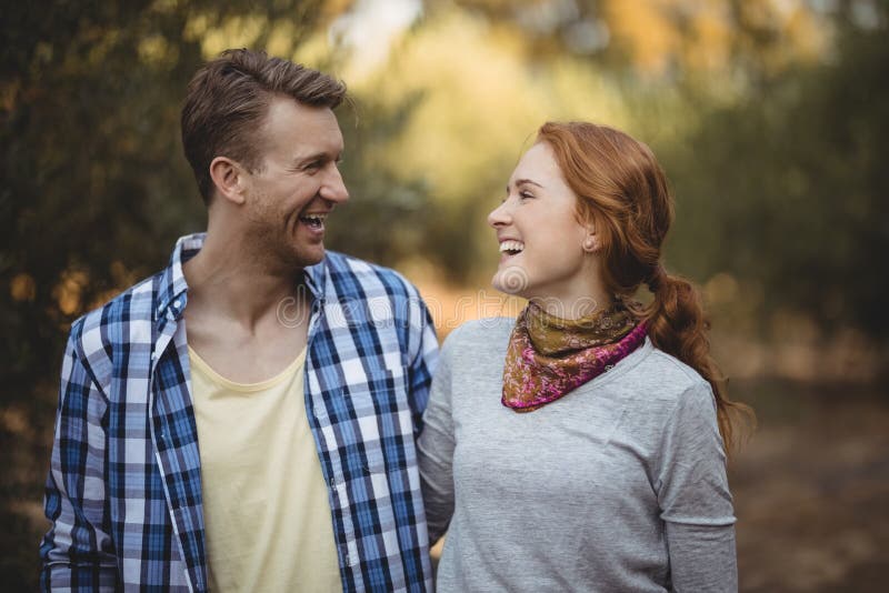 Cheerful couple looking at each other at olive farm royalty free stock images Cheerful couple looking at each other at olive farm royalty free stock images