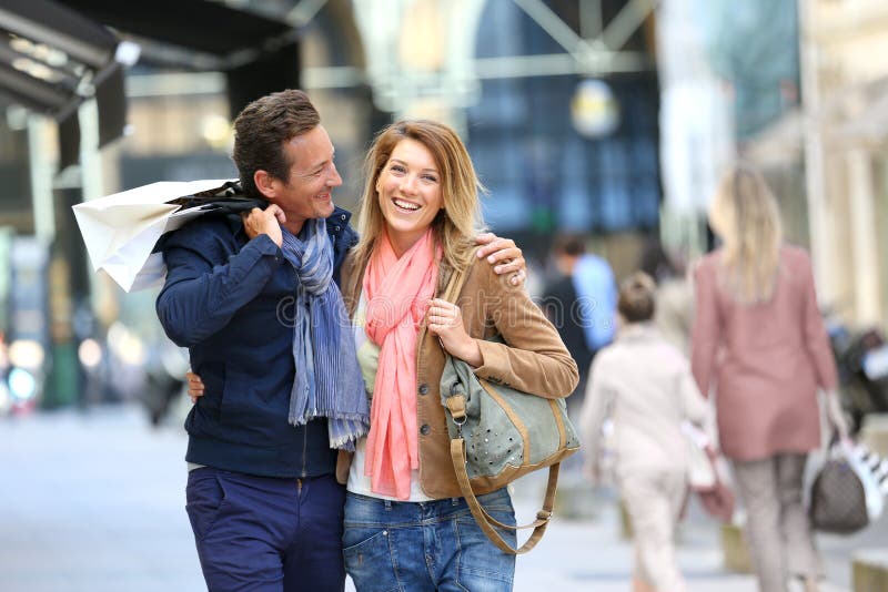Cheerful couple in town shopping stock photo Cheerful couple in town shopping stock photo