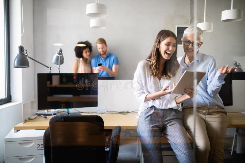 Cheerful coworkers in office during company meeting royalty free stock photos Cheerful coworkers in office during company meeting royalty free stock photos
