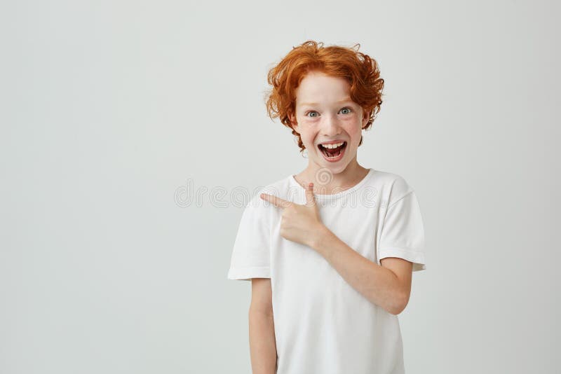Cheerful Cute Little Boy with Curly Ginger Hair and Freckles Happy Smiling and Pointing Aside with Finger on White Stock Photo - Image of curly, adolescence: 103249546 Cheerful Cute Little Boy with Curly Ginger Hair and Freckles Happy Smiling and Pointing Aside with Finger on White Stock Photo - Image of curly, adolescence: 103249546