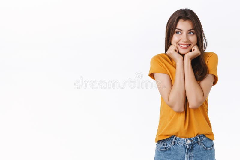 Cheerful, dreamy cute young woman thinking about something pleasant, recall nice lovely memories, holding face on royalty free stock image Cheerful, dreamy cute young woman thinking about something pleasant, recall nice lovely memories, holding face on royalty free stock image