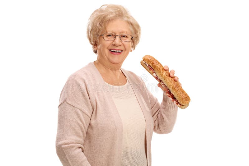 Cheerful elderly woman having a sandwich
