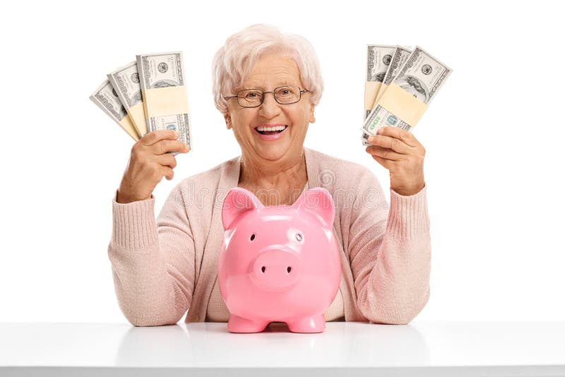 Cheerful elderly woman with a piggybank and money bundles