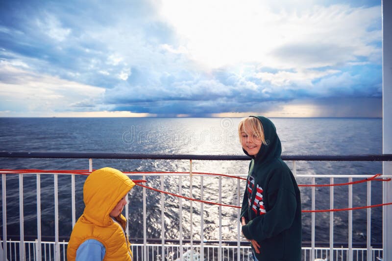Cheerful family having fun on the deck of big cruise ship travelling to the north royalty free stock image Cheerful family having fun on the deck of big cruise ship travelling to the north royalty free stock image