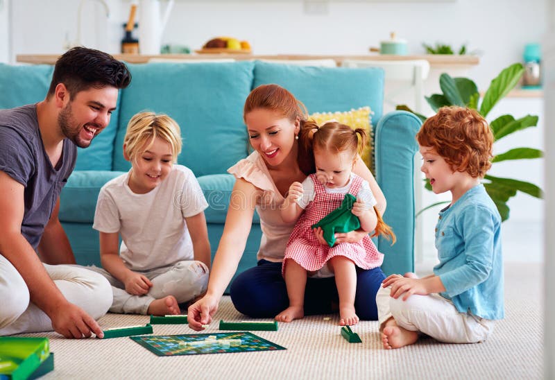 Cheerful Family Having Fun, Spending Time Together by Playing Board Games  at Home Stock Photo - Image of group, cozy: 212441444
