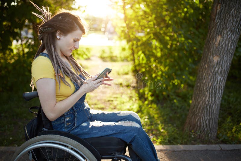 Cheerful fashion girl spending time with her mobile phone royalty free stock images Cheerful fashion girl spending time with her mobile phone royalty free stock images