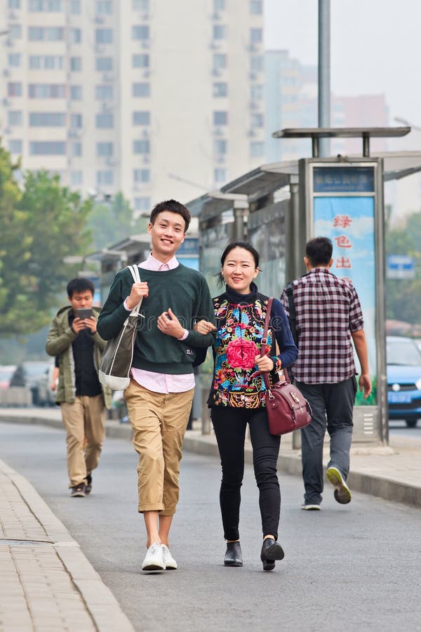 BEIJING-OCT. 19, 2014. Fashionable young couple. According research, Chinese consumers younger than 28 are that future optimistic having zero savings, spending everything on fashion and electronics. BEIJING-OCT. 19, 2014. Fashionable young couple. According research, Chinese consumers younger than 28 are that future optimistic having zero savings, spending everything on fashion and electronics.