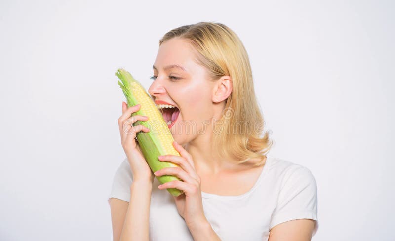 Cheerful female farmer. Farming, farmer girl with maize. corn crop. vitamin dieting food. healthy teeth. hunger stock images Cheerful female farmer. Farming, farmer girl with maize. corn crop. vitamin dieting food. healthy teeth. hunger stock images