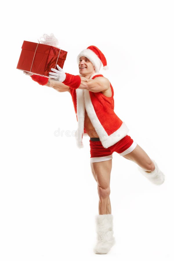 Cheerful fitness Santa Claus holding a red box stock photo Cheerful fitness Santa Claus holding a red box stock photo