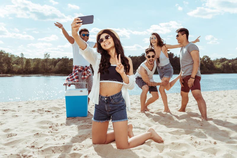 Cheerful Friends Taking Selfie Together On Smartphone On Beach Stock 