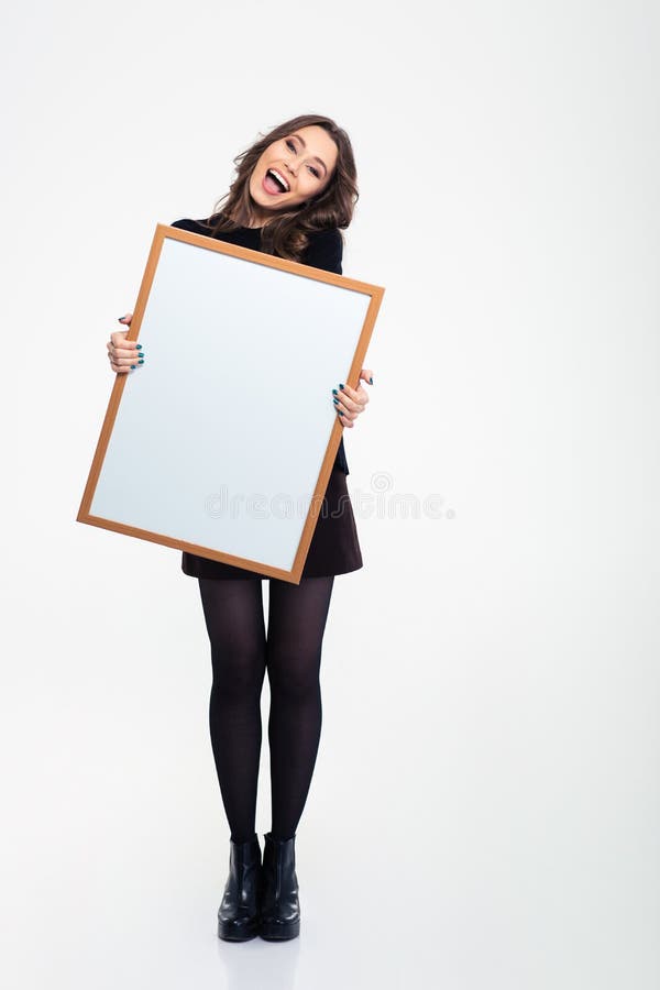 Cheerful girl holding blank board