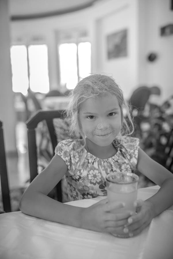 Cheerful girl juice drink stock image. Image of cute 66836131