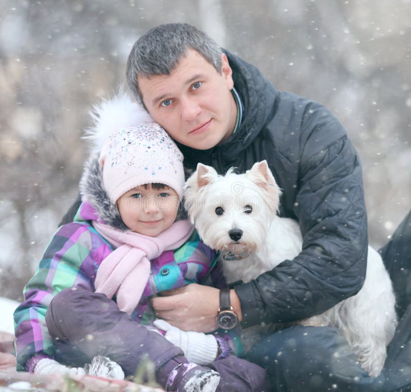 Cheerful girl with my dad and little dog royalty free stock images Cheerful girl with my dad and little dog royalty free stock images
