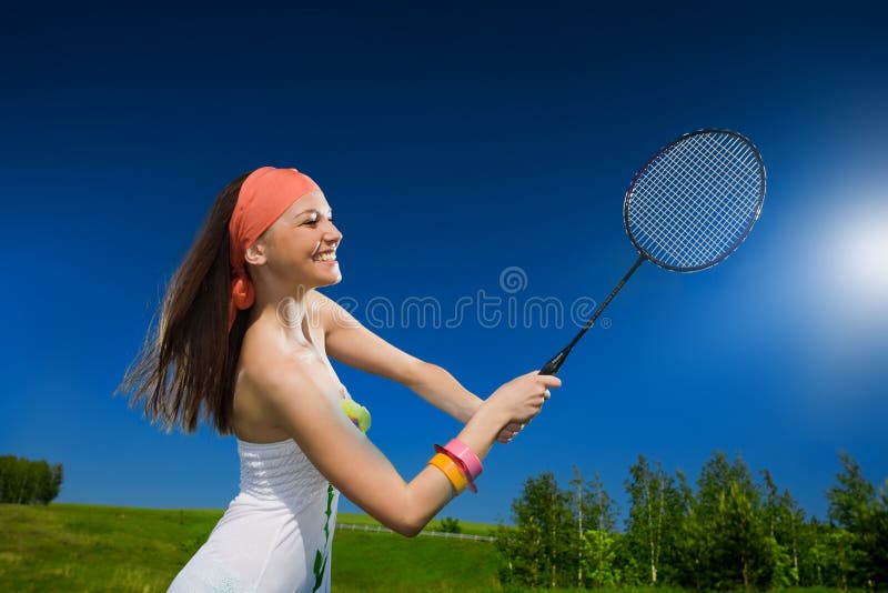 Cheerful girl with racket