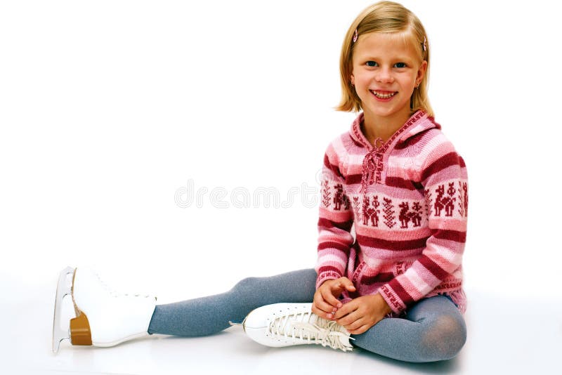 cheerful girl sitting on ice skates