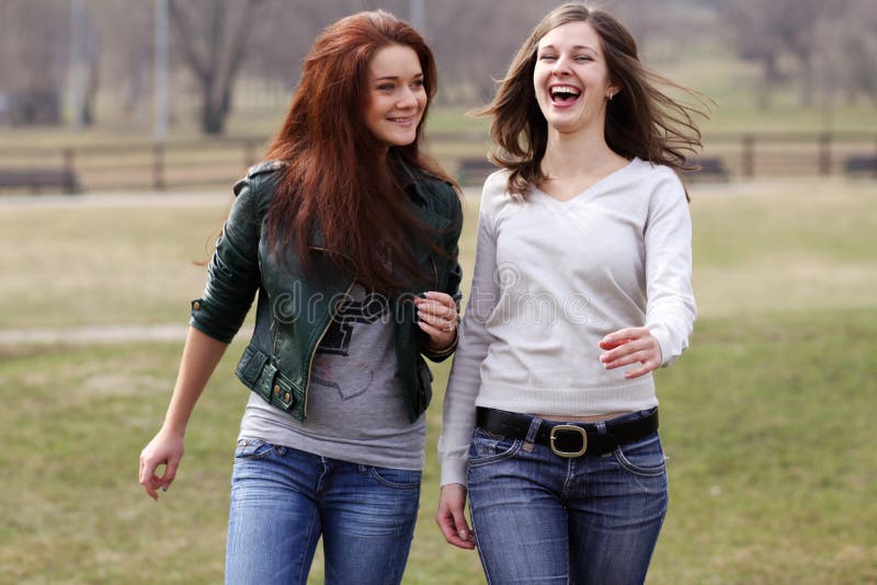 Cheerful girls in the spring park