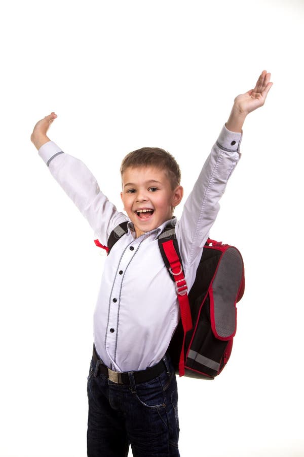 Cheerful happy school boy with hands up, on the white background. The end of the school year.