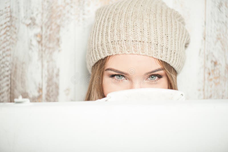 Cheerful hipster woman with valise near the wall royalty free stock photo Cheerful hipster woman with valise near the wall royalty free stock photo