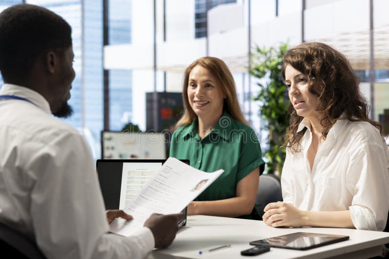 Cheerful HR managers asking interview questions to vet applicants royalty free stock photography