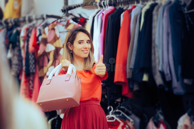 Cheerful lady choosing an accessory for her clothes. Cheerful lady choosing an accessory for her clothes