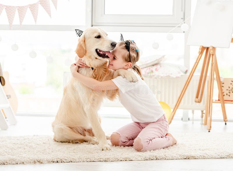 Cheerful little girl with cute dog