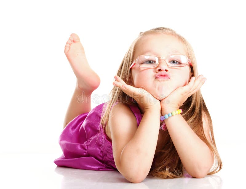 Cheerful little girl glasses funny is lying isolated