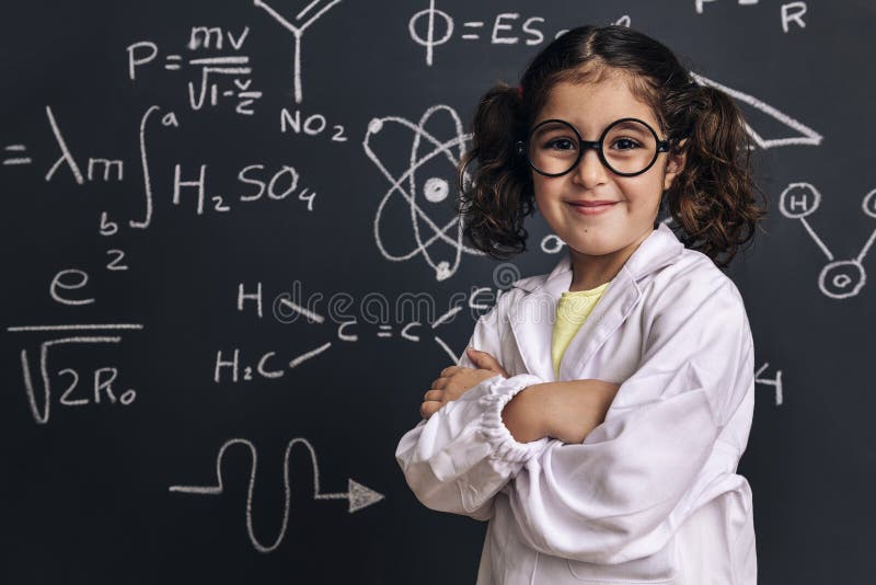 Cheerful little girl science student in lab coat