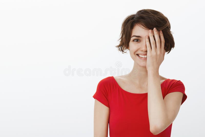 Cheerful lucky tender young woman short haircut feeling happy positive attitude have fun playful smile grinning hide royalty free stock photos Cheerful lucky tender young woman short haircut feeling happy positive attitude have fun playful smile grinning hide royalty free stock photos