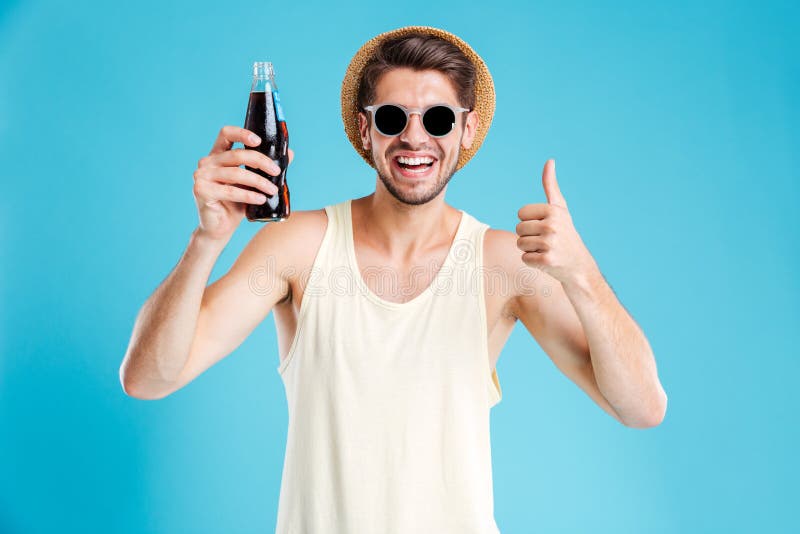 Cheerful Man Holding Bottle of Soda Nad Showing Thumbs Up Stock Photo ...