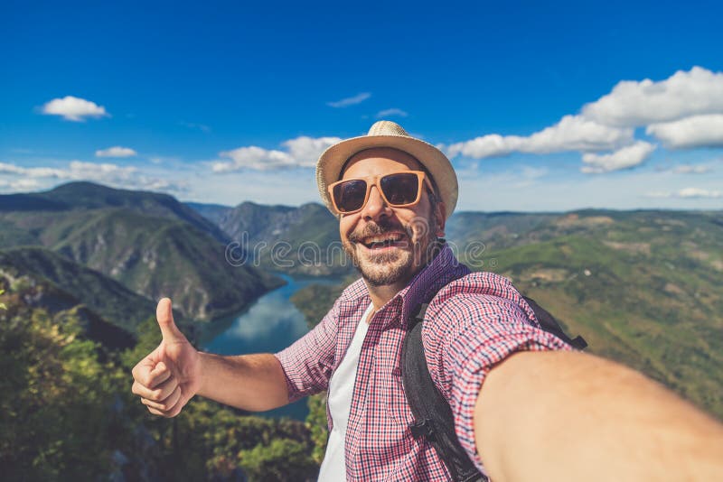 selfie of man holding his drivers lisense selfie of man holding his drivers lisense