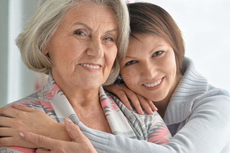 Cheerful mother and adult daughter