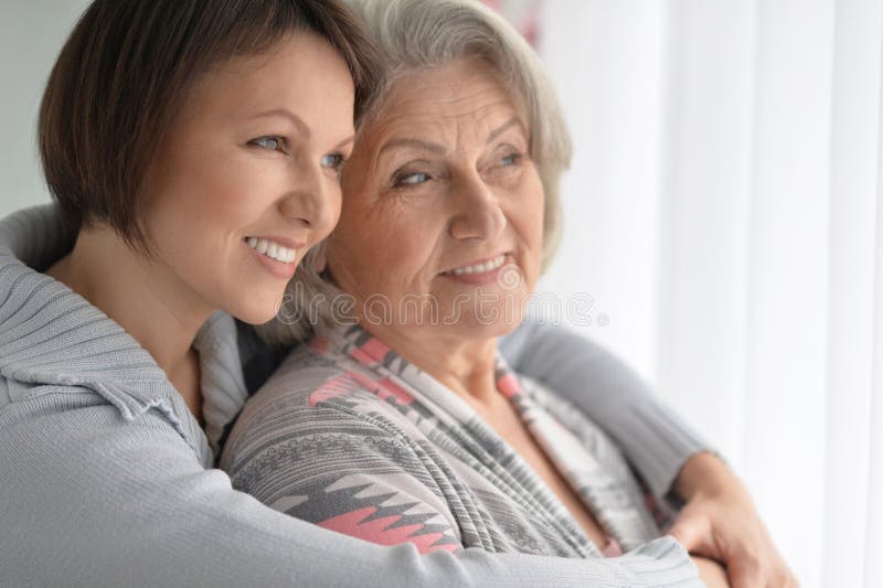 Cheerful mother and adult daughter