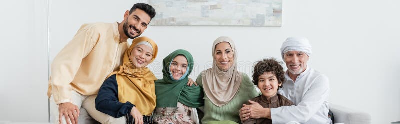 Cheerful multicultural muslim family looking at royalty free stock image