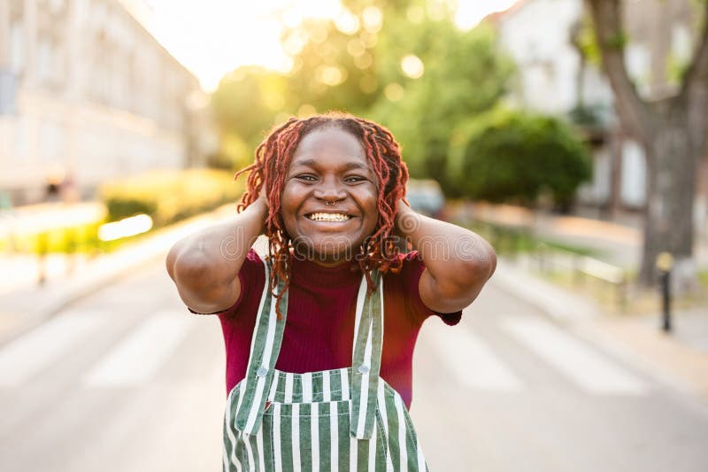 Non-binary person standing on the street in the city stock image