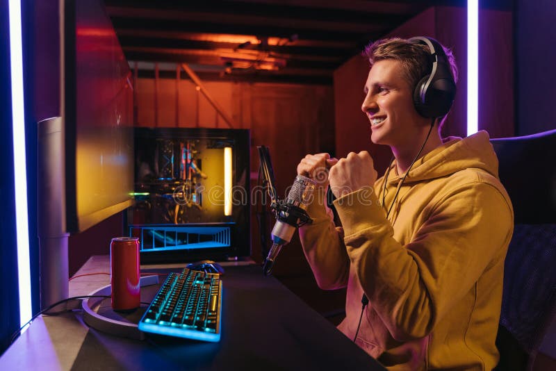 Premium Photo  Streamer man talking with multiple players into headphones  and winning video games competition. professional gamer streaming online  videogames with new graphics on powerful computer from gaming room